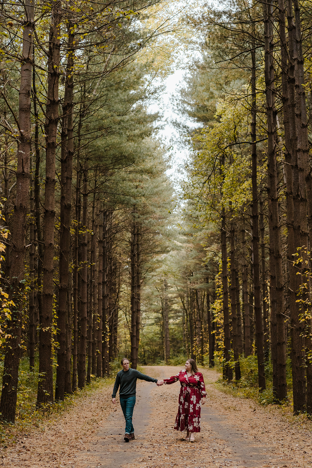 same-sex engagement photos in woods fall in ohio posing